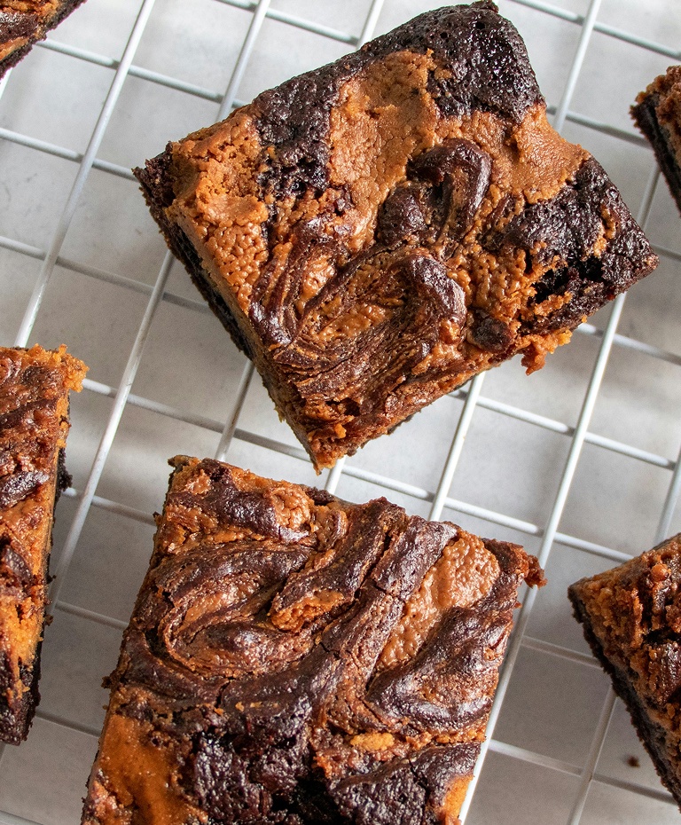 Peanut butter swirl brownies cooling on a wire rack